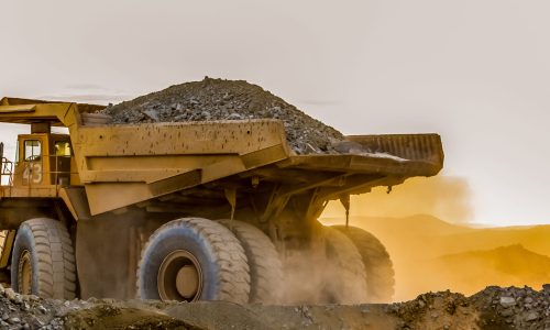 A large truck carrying sand on a platinum mining site in Africa